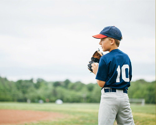 Boy with baseball suit