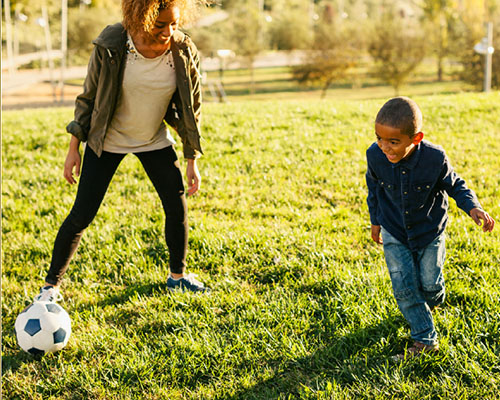 Mother and Son playing soccer