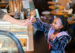 girl receiving ice cream cone